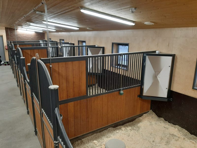 Automated feeders across a full stable